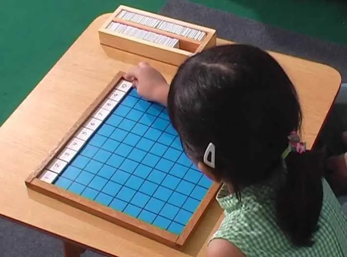 Completing the first row on Montessori Hundred Board.